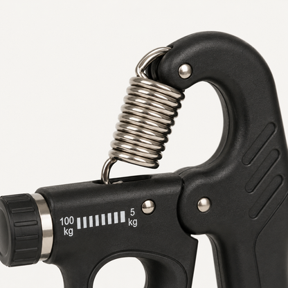 Detailfoto van de metalen veer en verstelbare weerstand van de handkracht trainer voor grip- en handtraining
